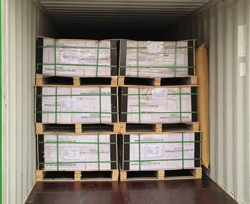Fully loaded shipping container with stacked stone panels