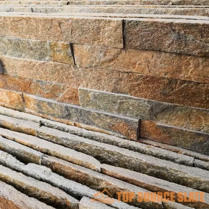 Interior wall featuring rusty quartzite natural stacked stone tiles.