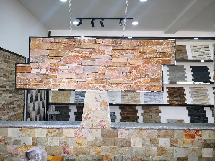 Close-up of Z Clad natural stone cladding panels in various shades