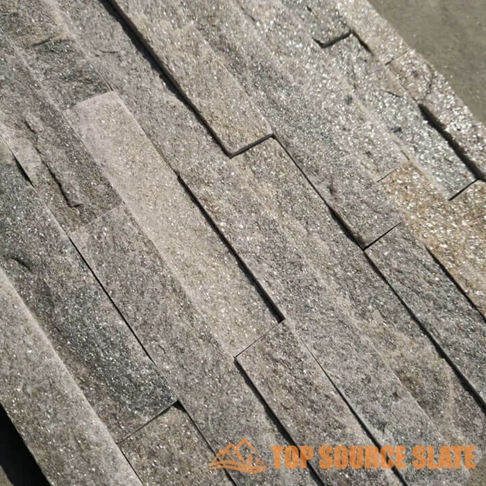 Modern exterior featuring high-quality cultured ledgestone panels