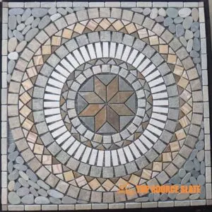 A beautifully designed slate mosaic medallion featuring intricate patterns.