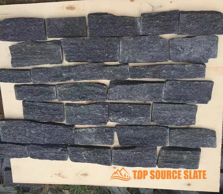 Black quartzite dry stack random cladding used for outdoor walls