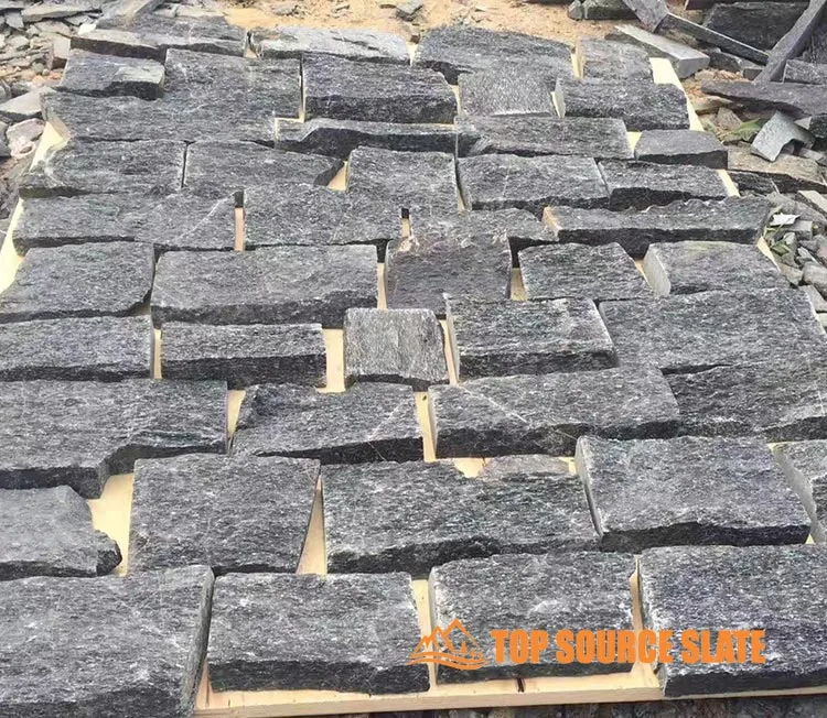 Black quartzite dry stack random cladding used for wall design