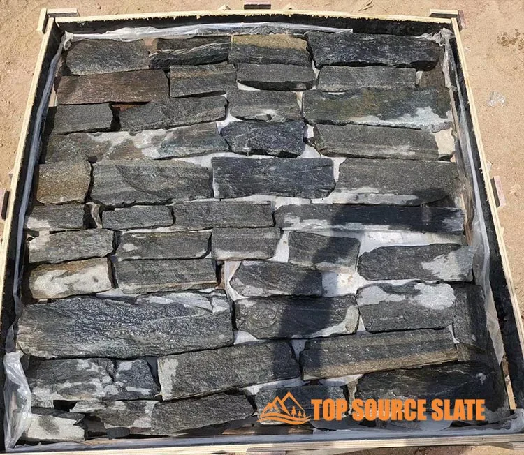 Close-up of black quartzite dry stack stone cladding showcasing texture and color variation
