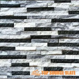 Exterior wall cladding made of gray stacked stone panels