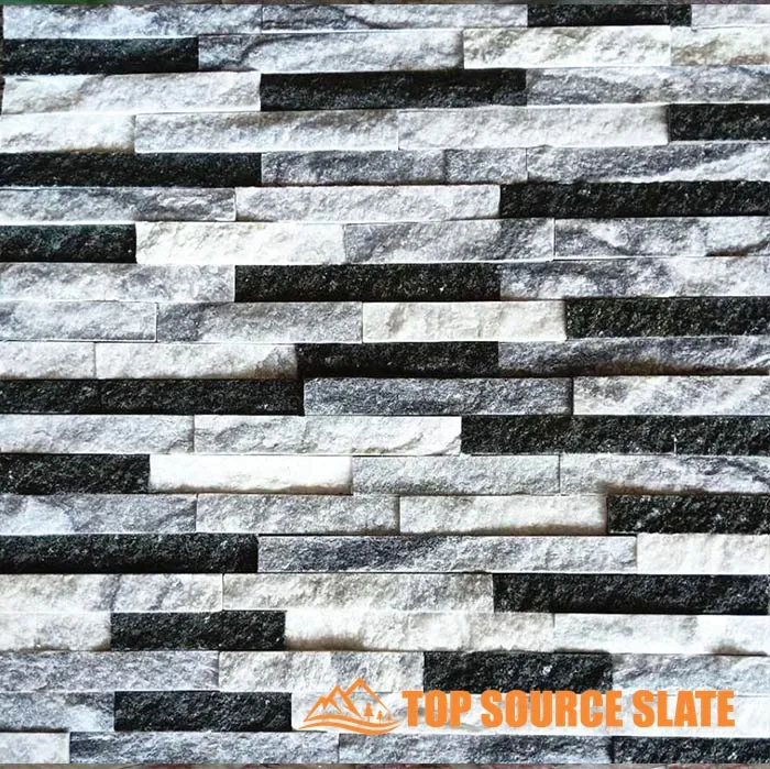Exterior wall cladding made of gray stacked stone panels