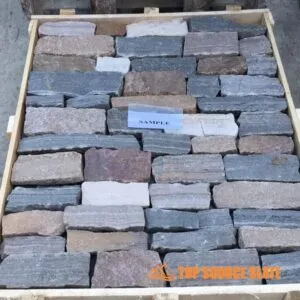 A close-up view of natural loose stone cladding in Earth tones