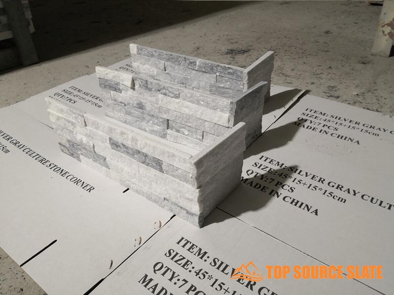 Corner piece of Alaska Gray Split Face stone with textured finish