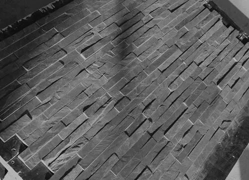 Elegant black slate split face wall tiles for interior and exterior design.