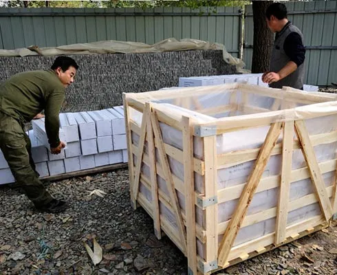 Carefully arranged stacked stone panels in protective packaging