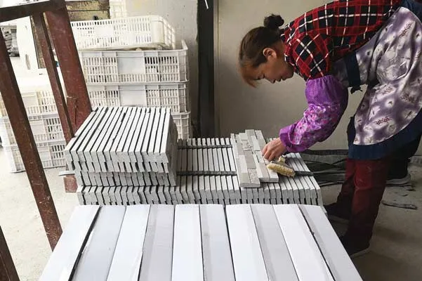 Inspecting high-quality stacked stone tiles for defects