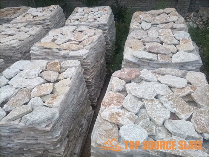 Variety of natural loose stone cladding in earthy tones