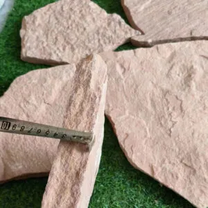 Loose pink quartzite stones in random shapes for landscaping